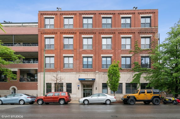 Front view of a four-story brick building.