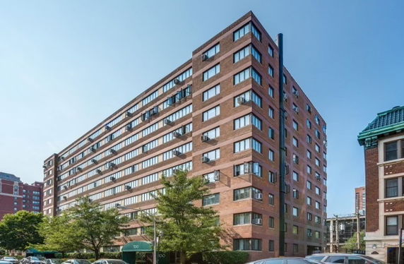 Front view of a multi-story brick residential building.