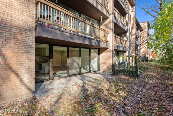 View of a multi-story building with brick exterior and balconies.
