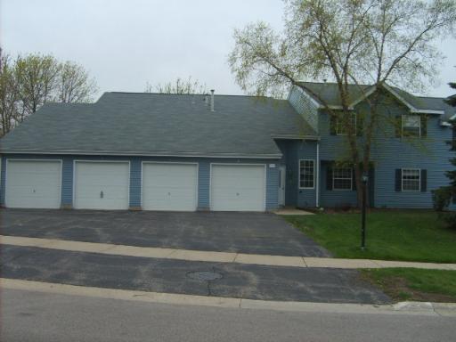Front view of a house with multiple garages attached.