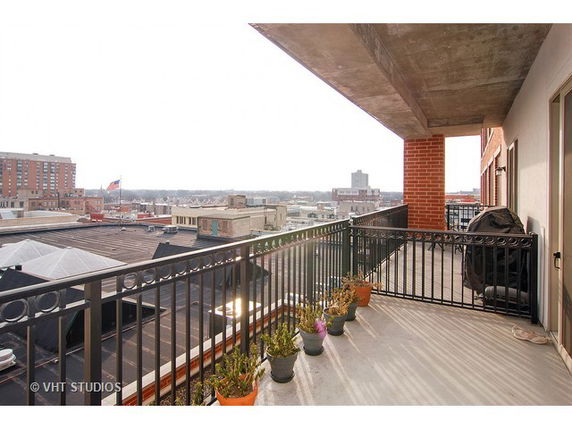 Balcony view overlooking urban buildings and cityscape