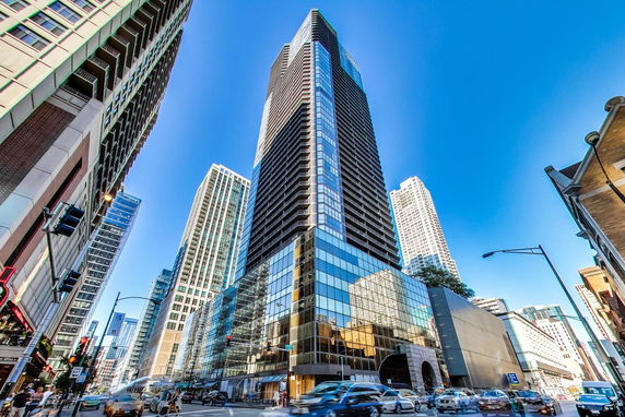 Front view of a modern skyscraper in an urban area.