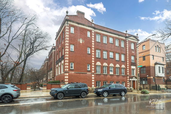 Front view of a multi-story brick building.