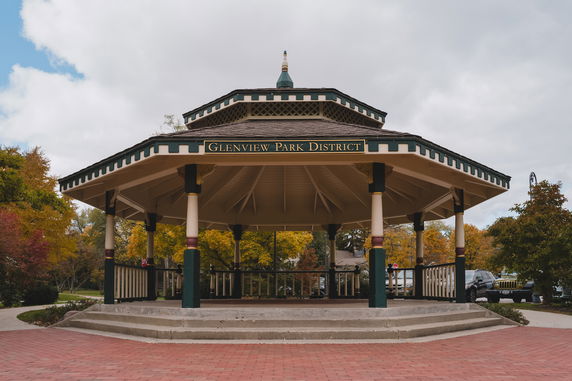 Front view of a park pavilion with a gabled roof structure.