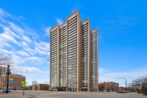 Front view of a high-rise building with multiple floors.