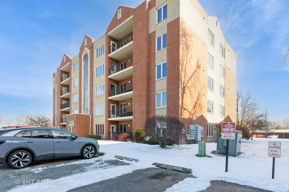 Front view of a multi-story brick apartment building