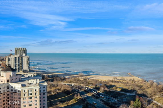 Panoramic view of buildings and a large body of water.