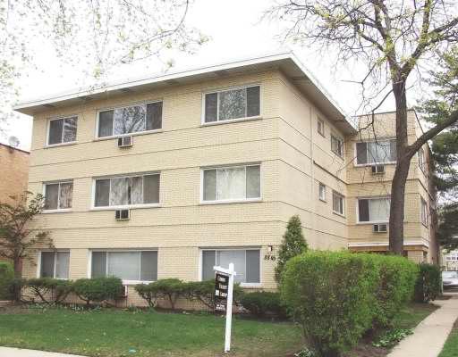 Front view of a three-story apartment building.