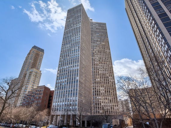 Front view of a tall skyscraper building.