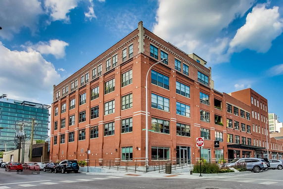 Front view of a multi-story brick building.