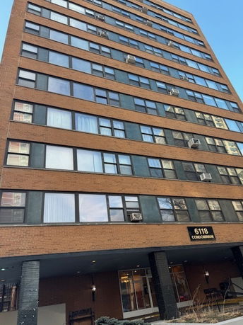 Front view of a multi-story condominium building.