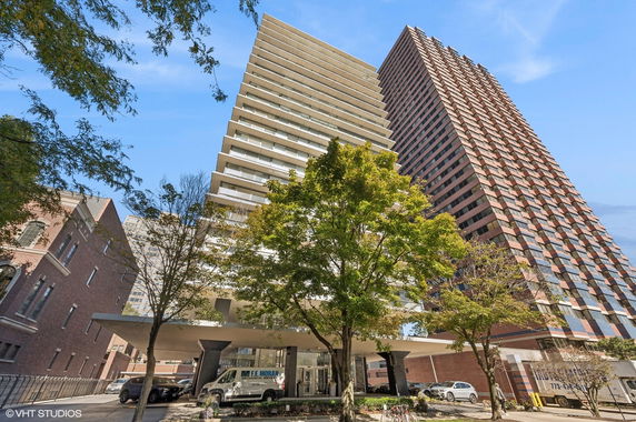 Front view of a multi-story residential building with a modern design.