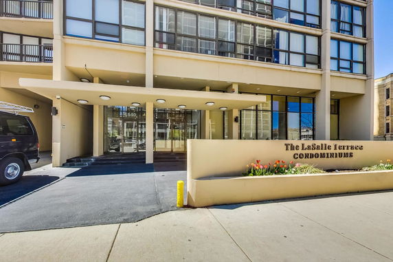 Front view of a condominium building entrance.