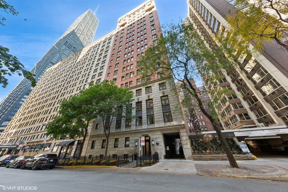 Front view of tall residential and commercial buildings with varied architecture.