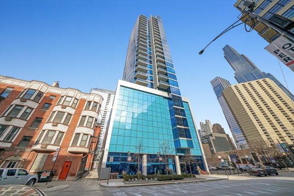 Front view of a modern high-rise building with glass facade.