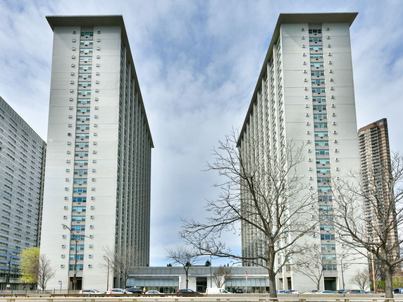 Front view of two high-rise residential towers.