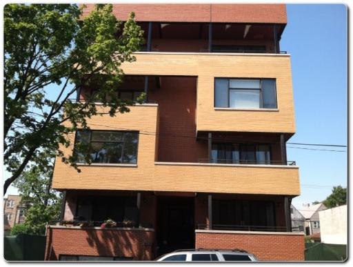 Front view of a modern multi-story building with a unique facade design.