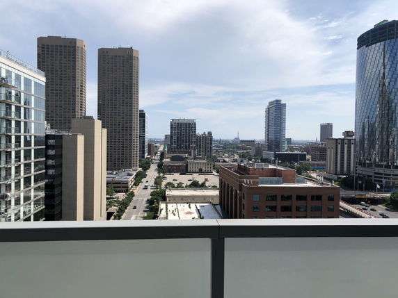 Panoramic view of urban skyline with various high-rise buildings.