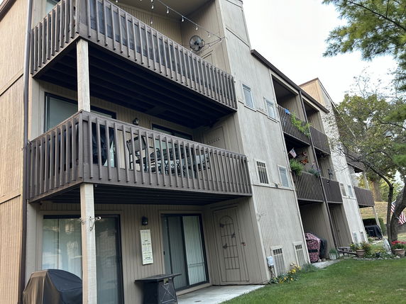 Angled view of a multi-story building with balconies.