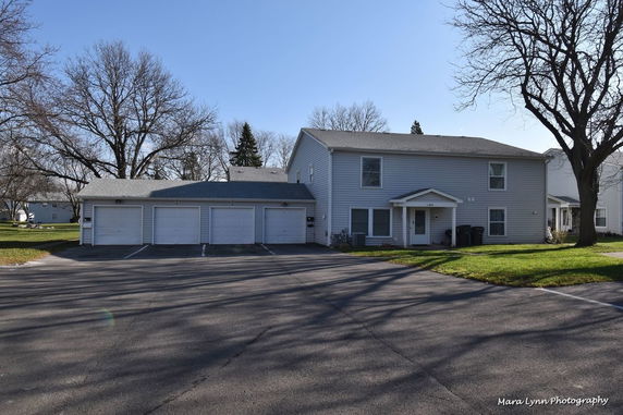 Front view of a two-story house with an attached garage.