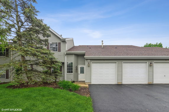 Front view of a two-story house with a double garage.