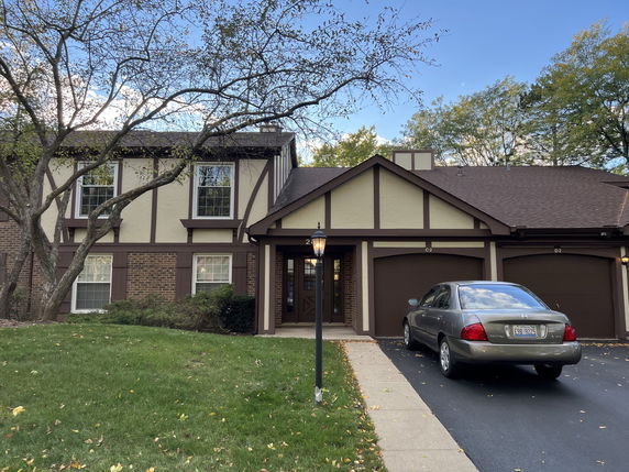 Front view of a two-story house with double garage.