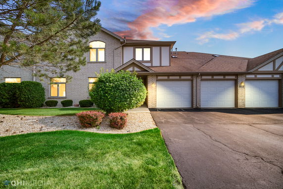Front view of a two-story house with a double garage.