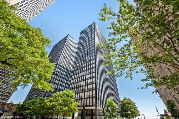 Front view of modern high-rise buildings with glass facades.