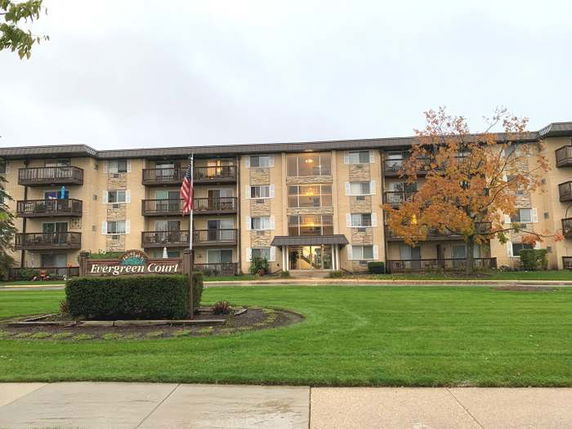 Front view of a multi-story apartment building.