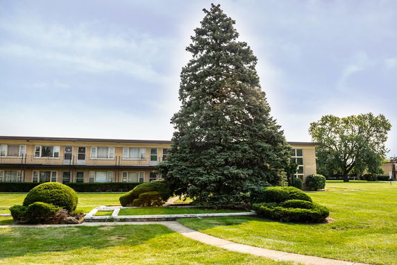 View of a two-story building with balconies.