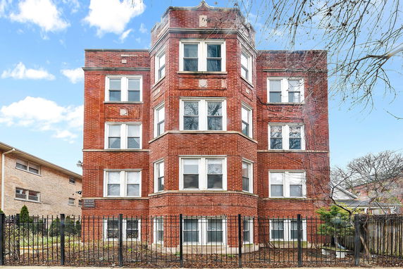 Front view of a multi-story brick building.