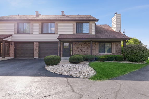 Front view of a two-story house with a double garage.