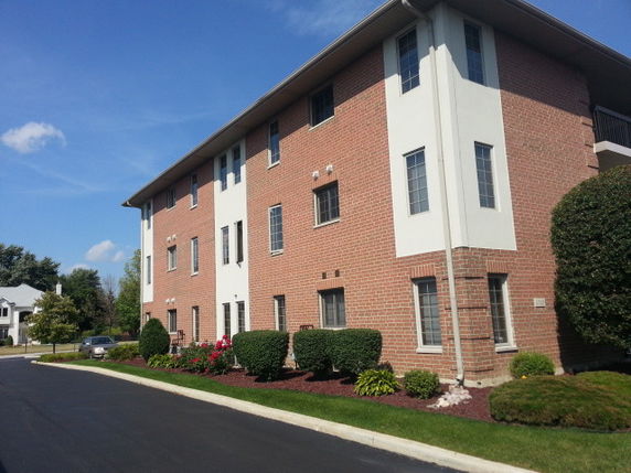 Front view of a multi-story brick building.