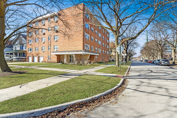 Front view of a multi-story brick building.