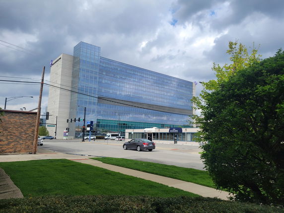 View of a multi-story glass facade building.