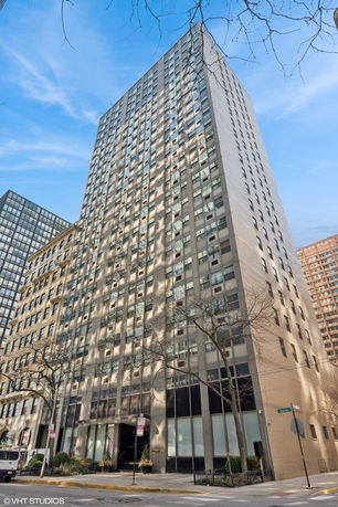 Front view of a high-rise residential building with numerous windows.