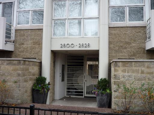 Front view of a building entrance with a gated entryway.