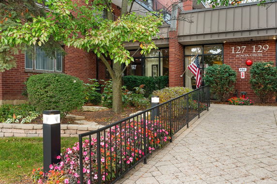 Front view of a building with brick exterior and numbered entrance.