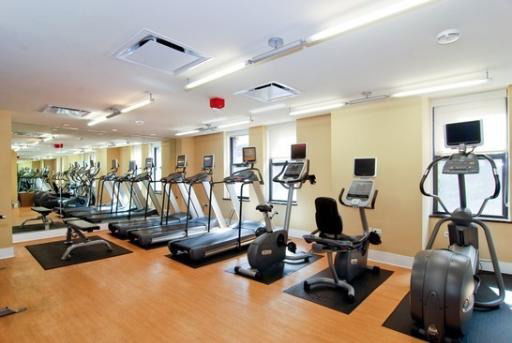 Indoor gym area with exercise equipment.