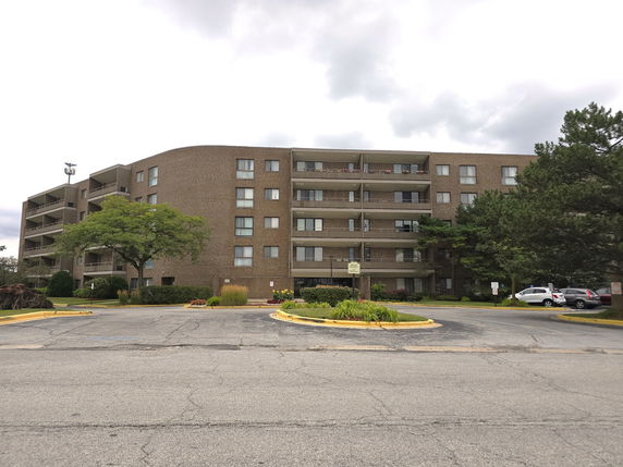 Front view of a multi-story apartment building.