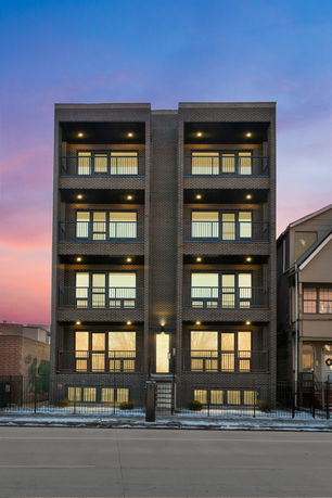 Front view of a multi-story building with balconies