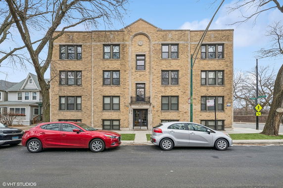 Front view of a multi-story brick apartment building