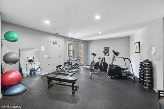 Indoor gym area with exercise equipment and fitness gear.