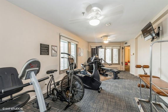 Indoor gym area with exercise equipment.
