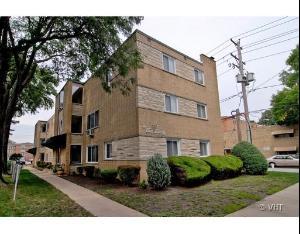 Front view of a three-story apartment building.