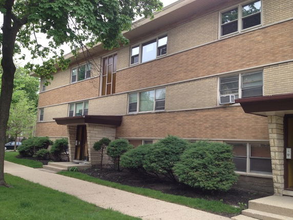 Front view of a three-story apartment building.