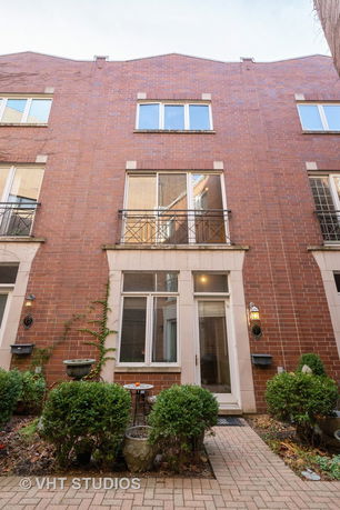 Front view of a multi-story brick building.