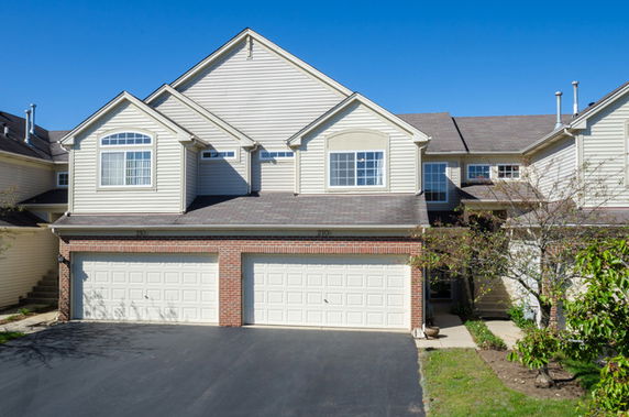 Front view of a two-story house with a double garage.