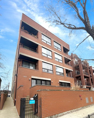 Front view of a multi-story brick building.