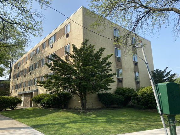 Front view of a multi-story residential building.